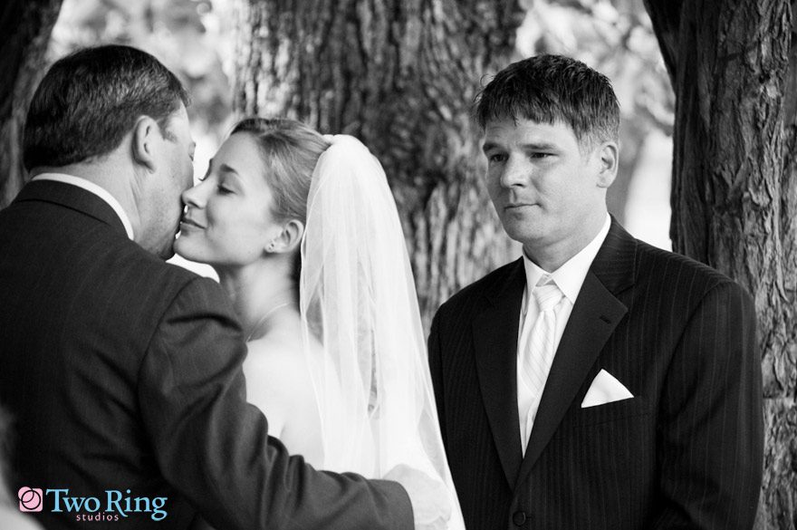 Bride kisses her father's cheek