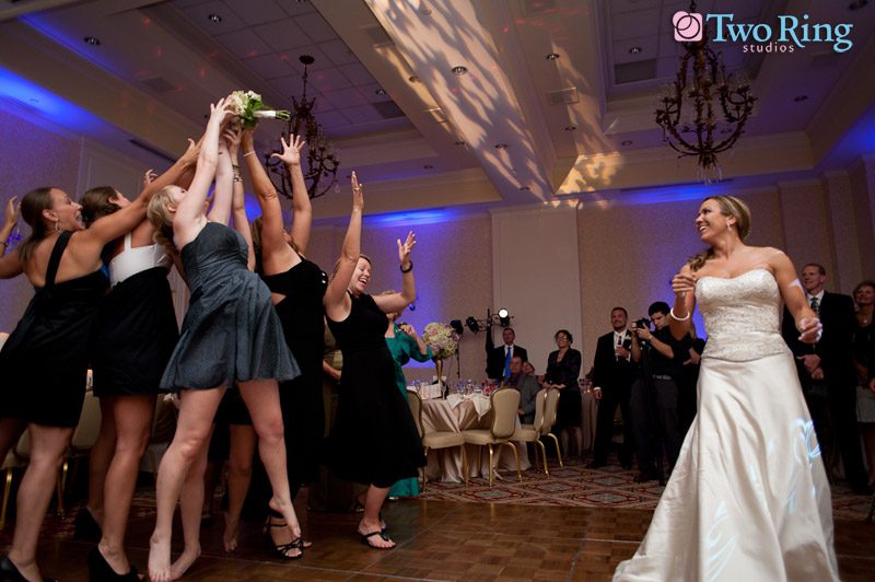 Bride tosses the bouquet at wedding reception