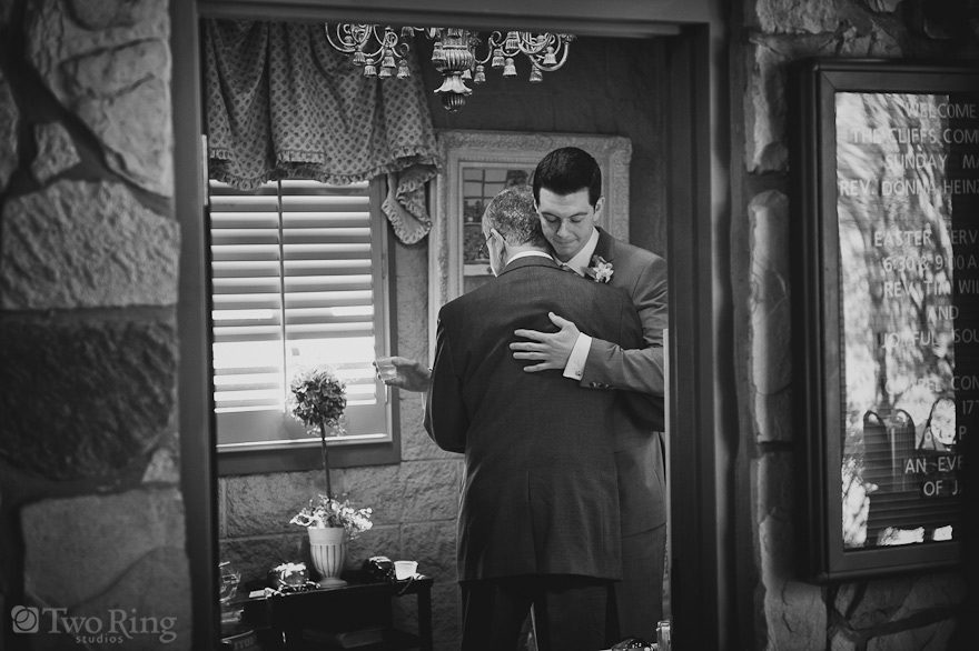 Groom hugs his father