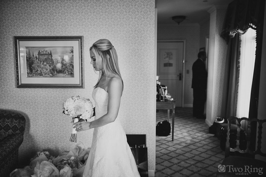Photo of bride looking at bouquet