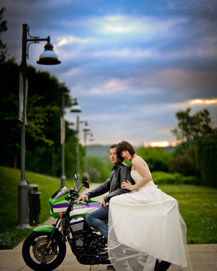 Bride on motorcycle with groom