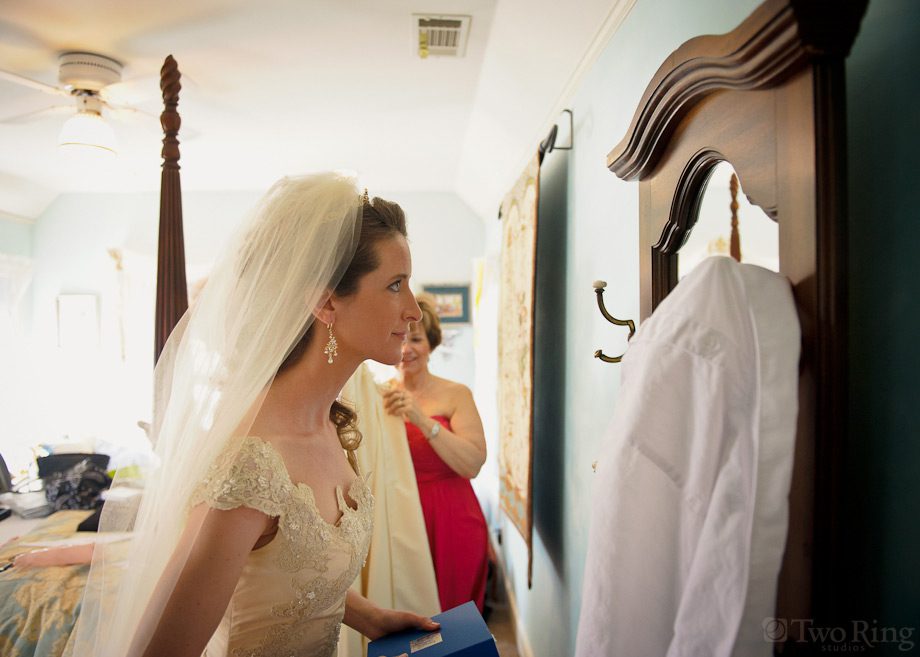 Bride looks in mirror