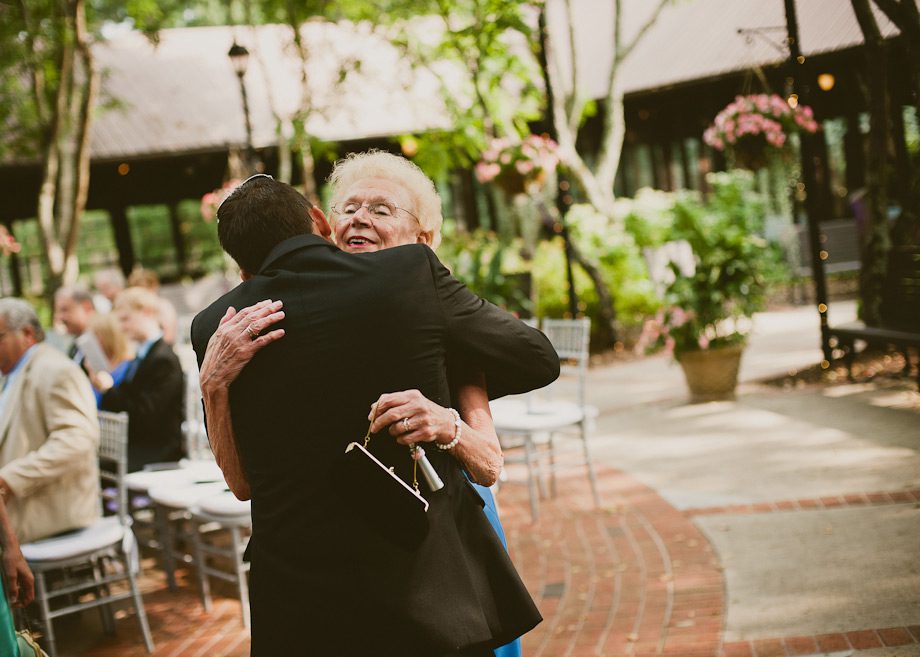 Groom hugging at wedding